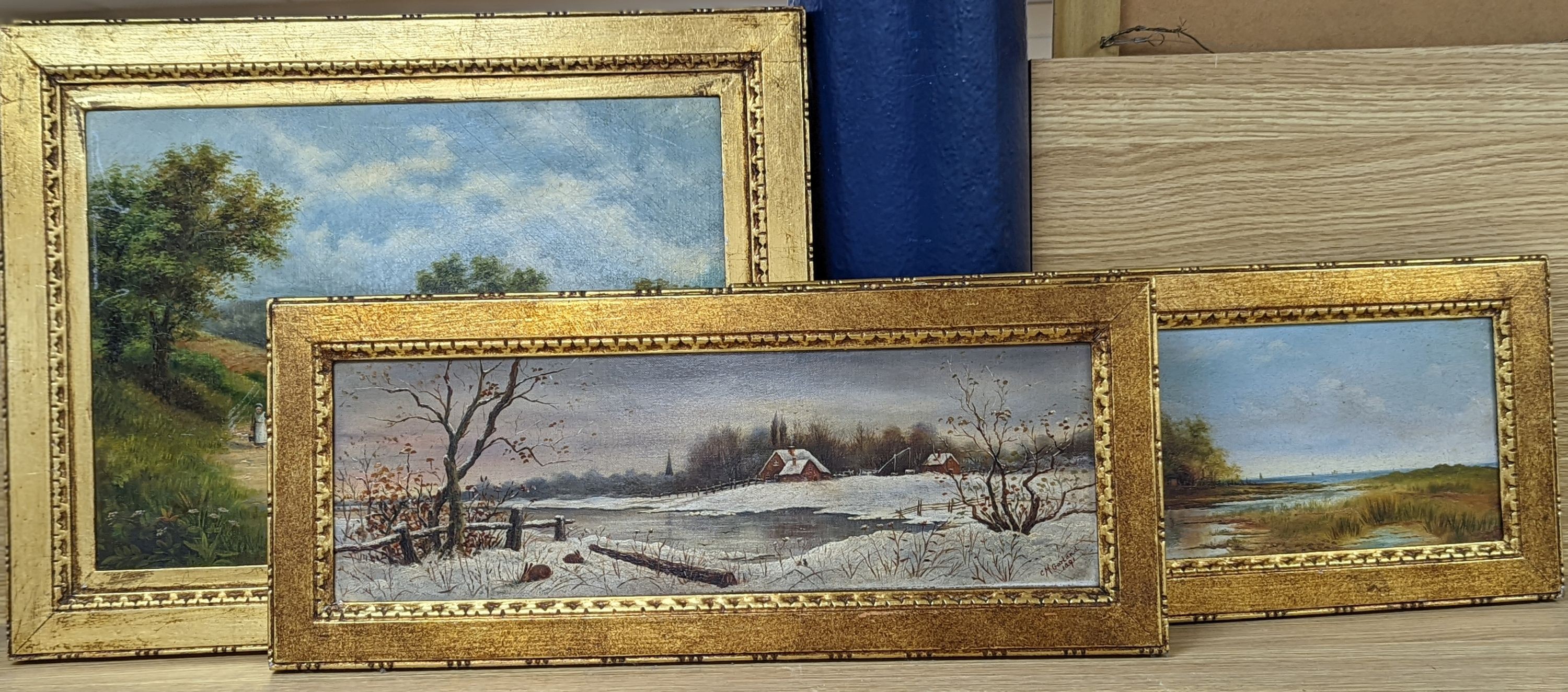 C. M. Garland, pair of oils on canvas, Summer and Winter landscapes, signed and dated 1891, 13 x 42cm and an oil of figures beside a pond, 1892, 27 x 37cm